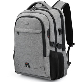 Black Executive Backpack TL084 with USB port, waterproof design, and fits up to 17-inch laptops – ideal for business or travel.