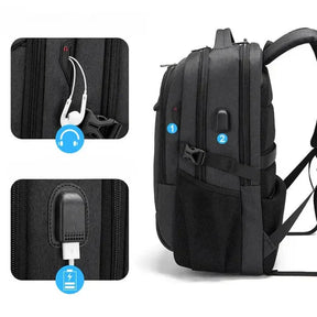 Black Executive Backpack TL084 with USB port, waterproof design, and fits up to 17-inch laptops – ideal for business or travel.