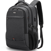 Black Executive Backpack TL084 with USB port, waterproof design, and fits up to 17-inch laptops – ideal for business or travel.